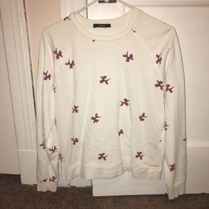 A semi crop top that has animal balloons all over.